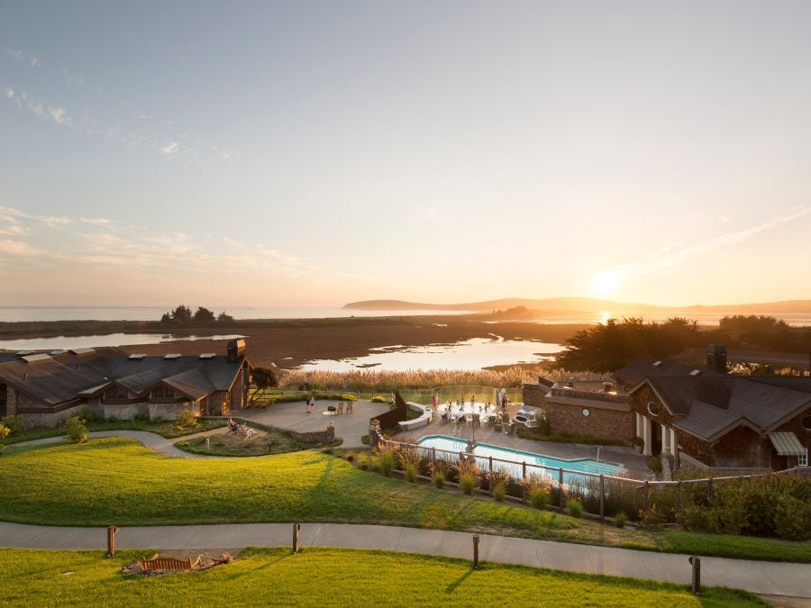 The lodge along the Pacific Coast sparkles in the setting sun