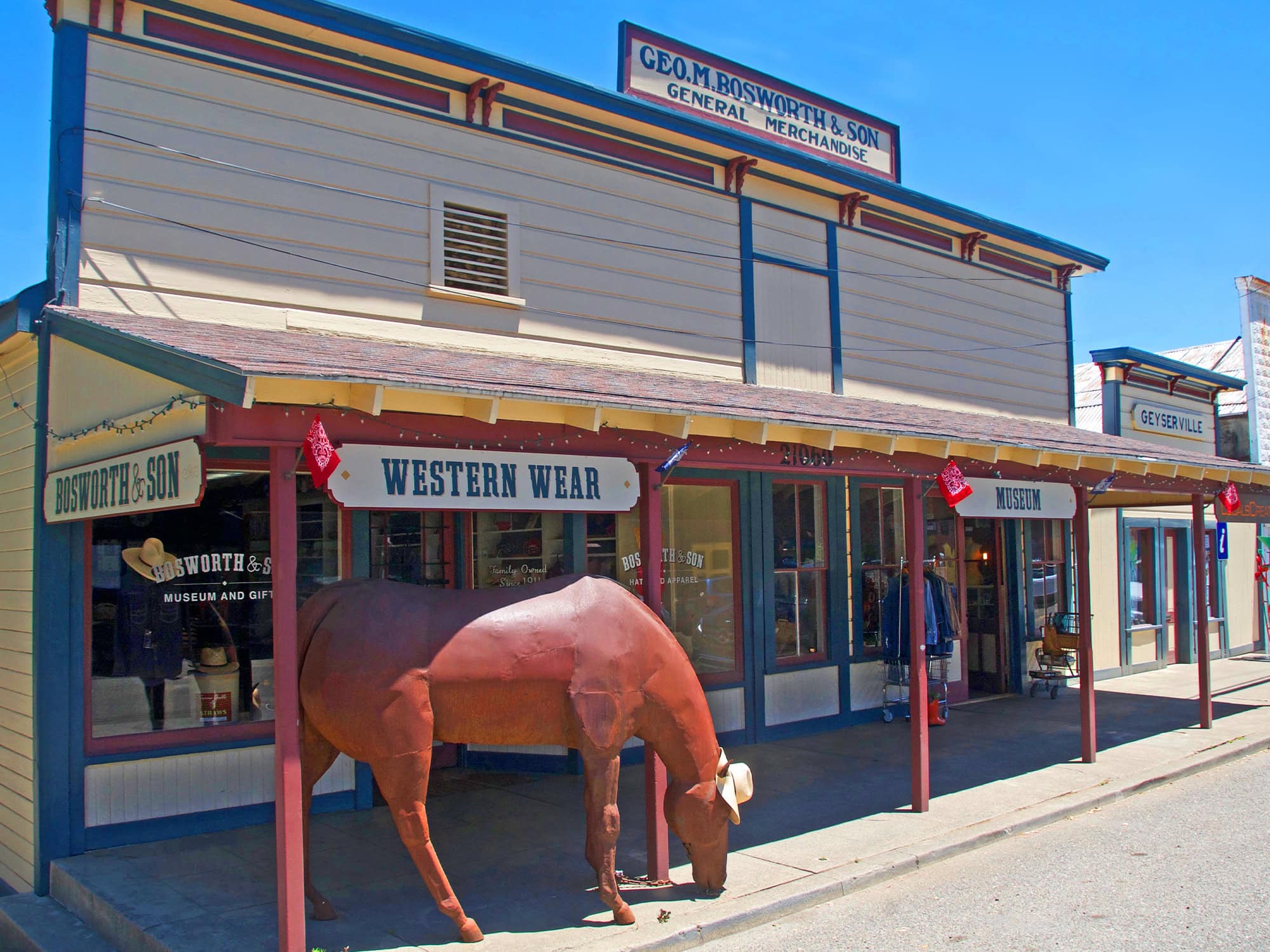 A sculpture of a horse sits outside of the western storefront