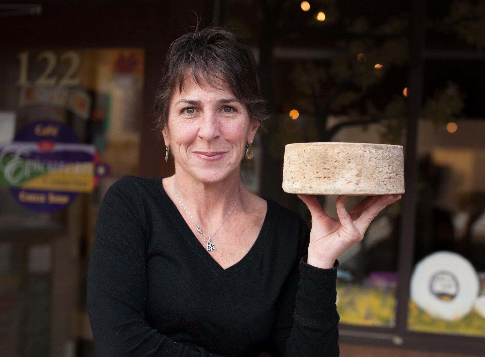 Picture of Sheana Davis of The Epicurean Connection holding cheese