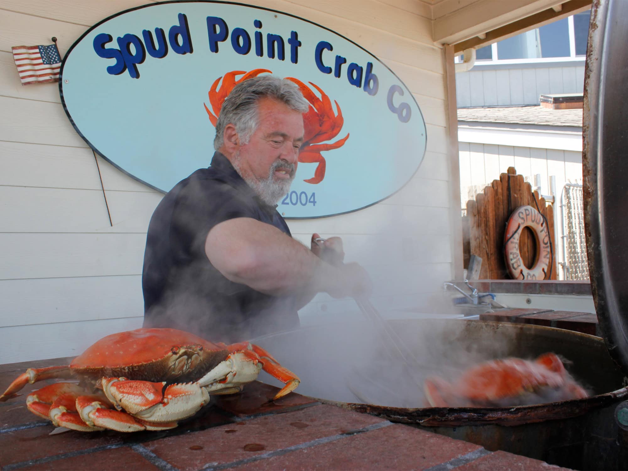 man cooking crab at spud point in Sonoma County