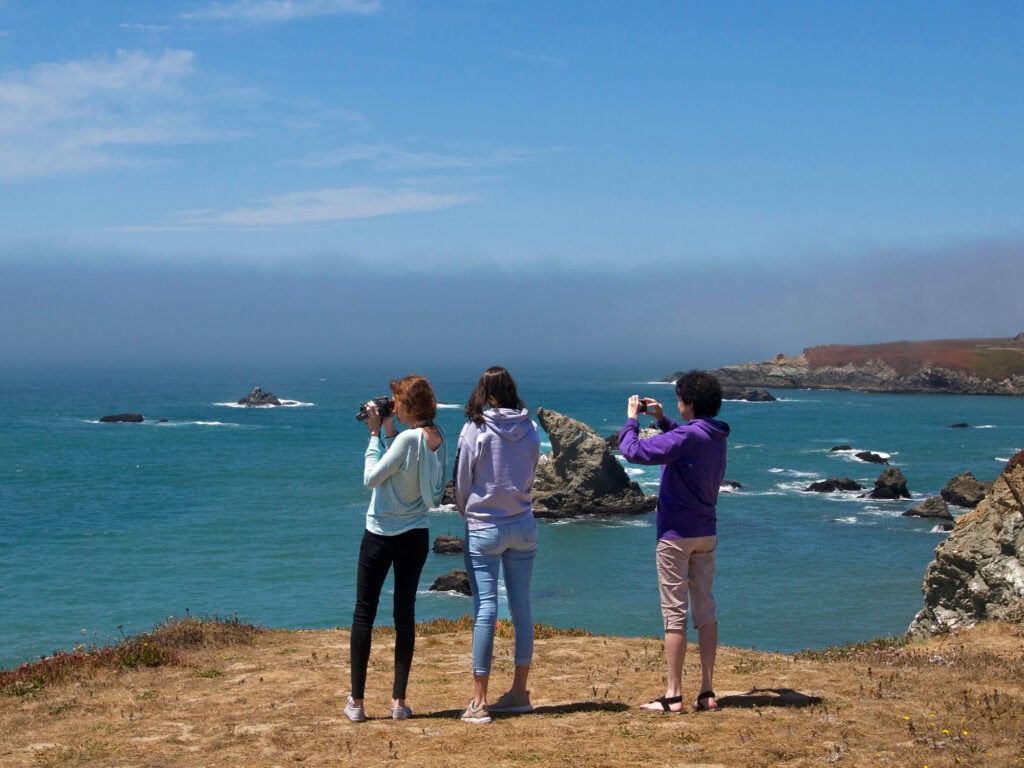 people looking out at the ocean at gleason beach in sonoma county