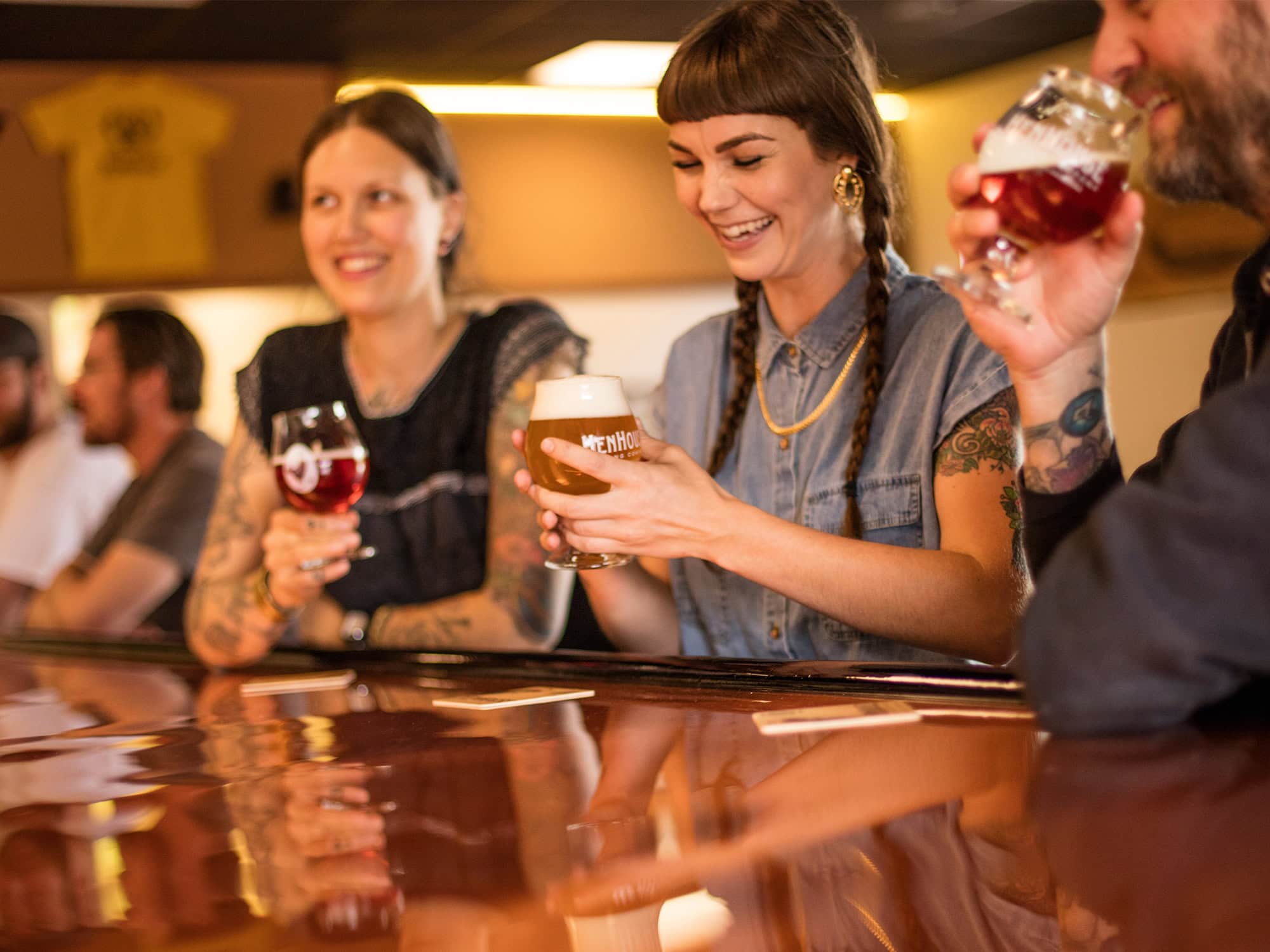 friends drinking beer at henhouse brewery