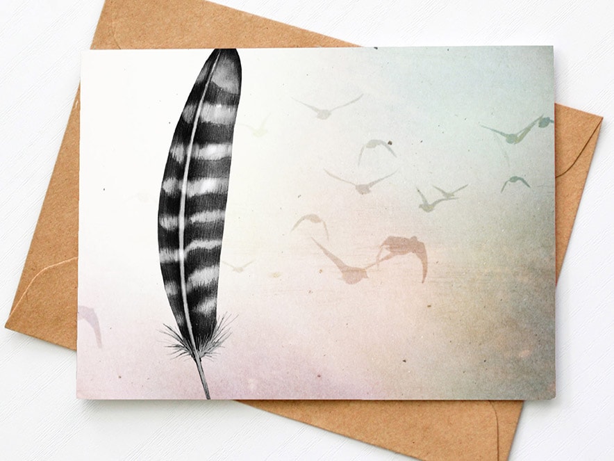 note card with feather and envelope