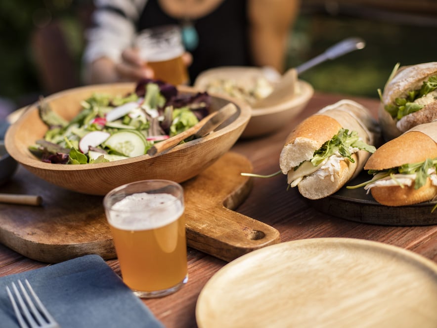 General shot of salad, sandwiches, and beverage. 