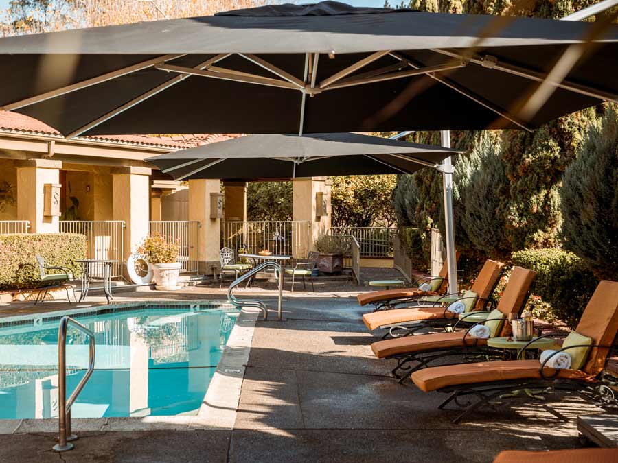 The pool is surrounded by lounge chairs