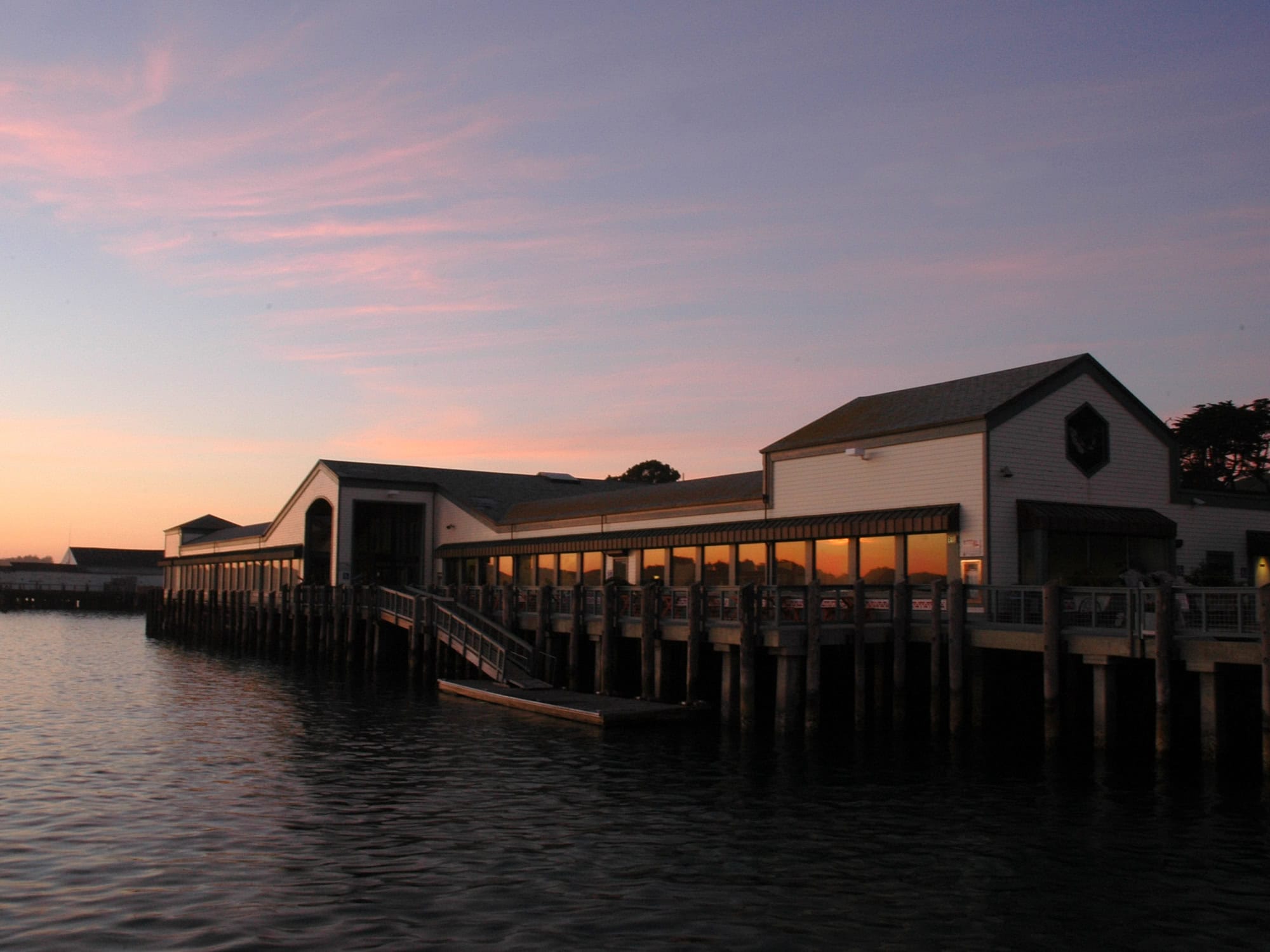 The sun sets on this restaurant on the bay