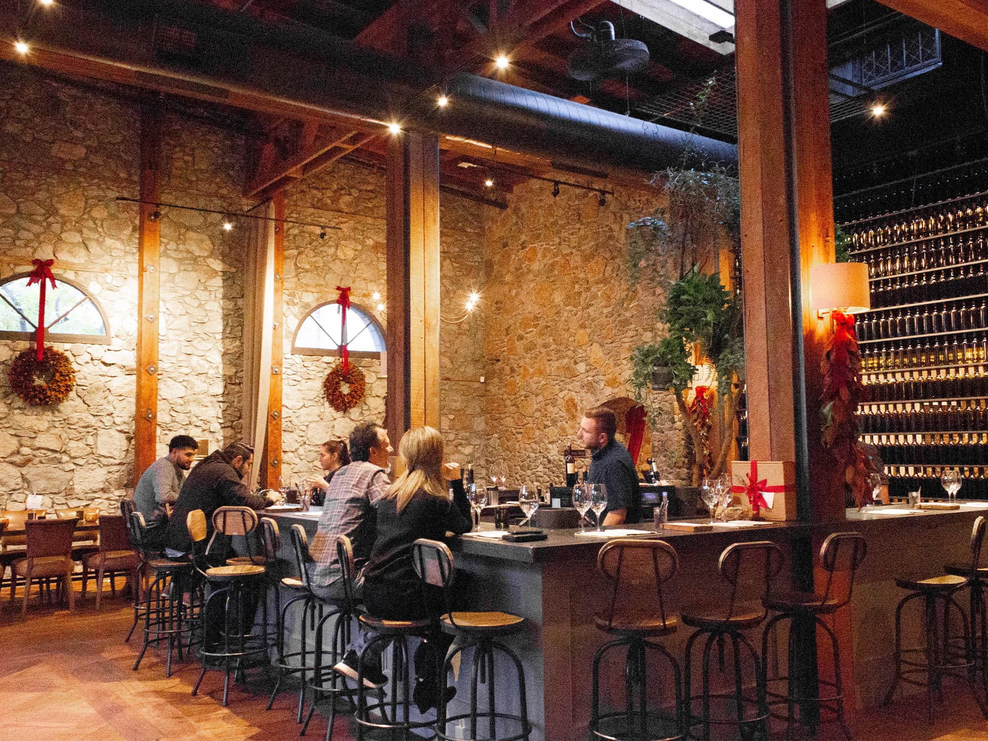 People sit inside the rustic tasting room