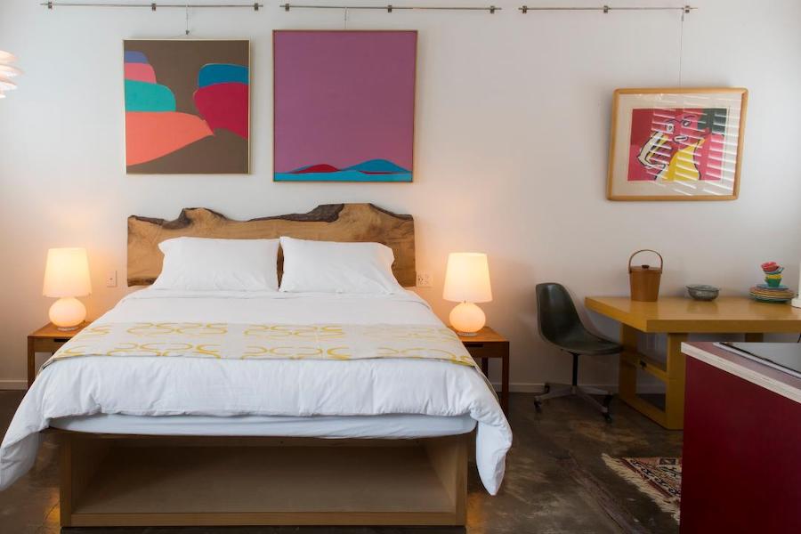 Astro Motel guest room with recycled-material furnishings and local artwork