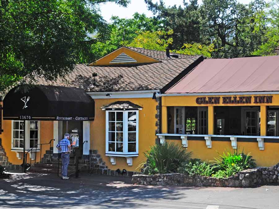 A man reads the menu outside of the entrance to Glen Ellen Inn