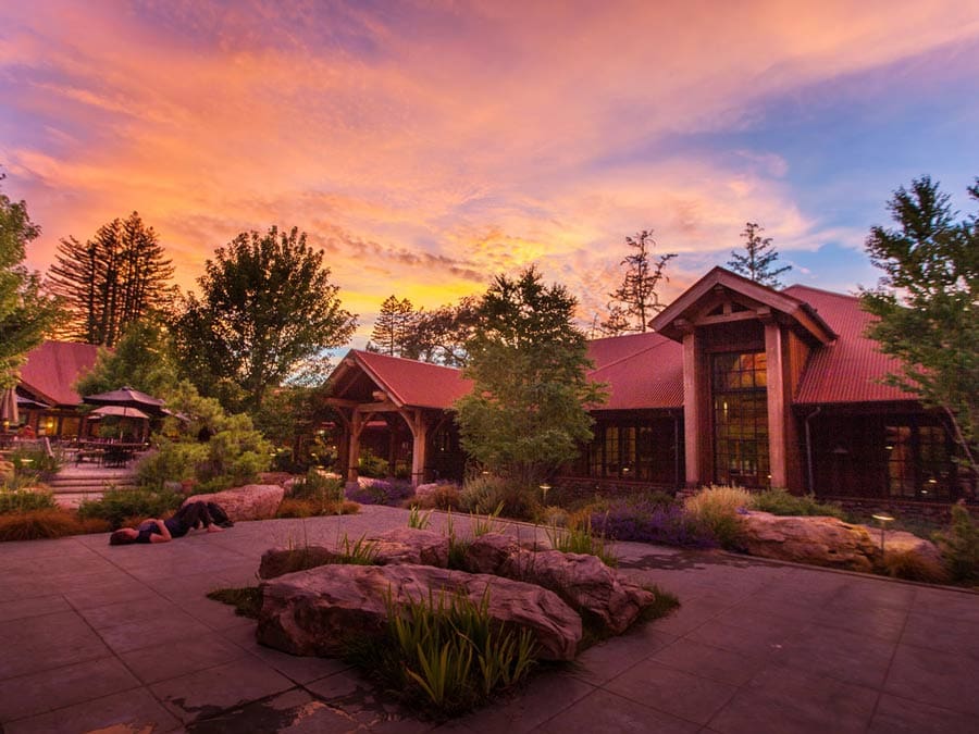 The retreat center in the setting sun surrounded by trees