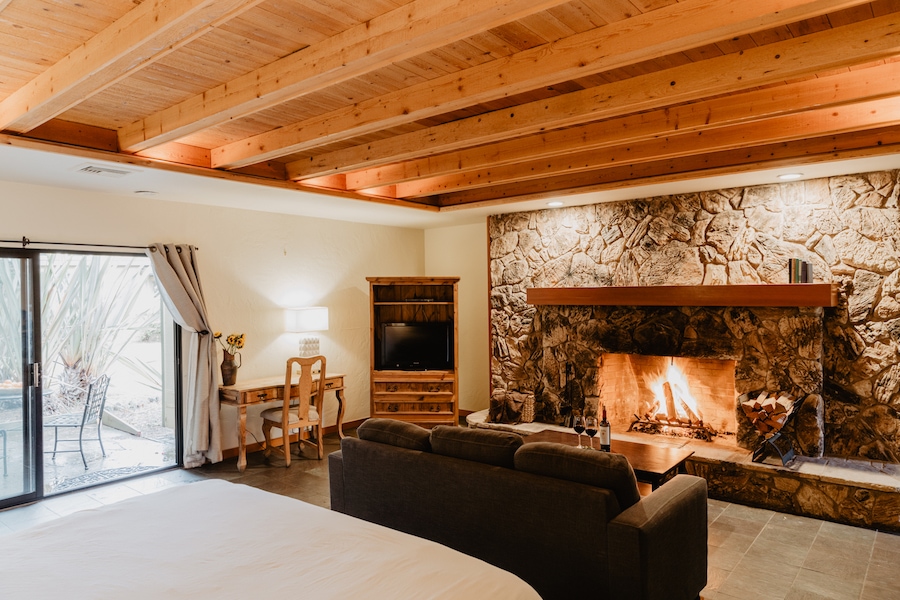 Guest room with fireplace at Sonoma Coast Villa