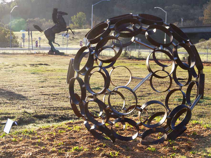 A metal sculpture of a sphere in Geyserville