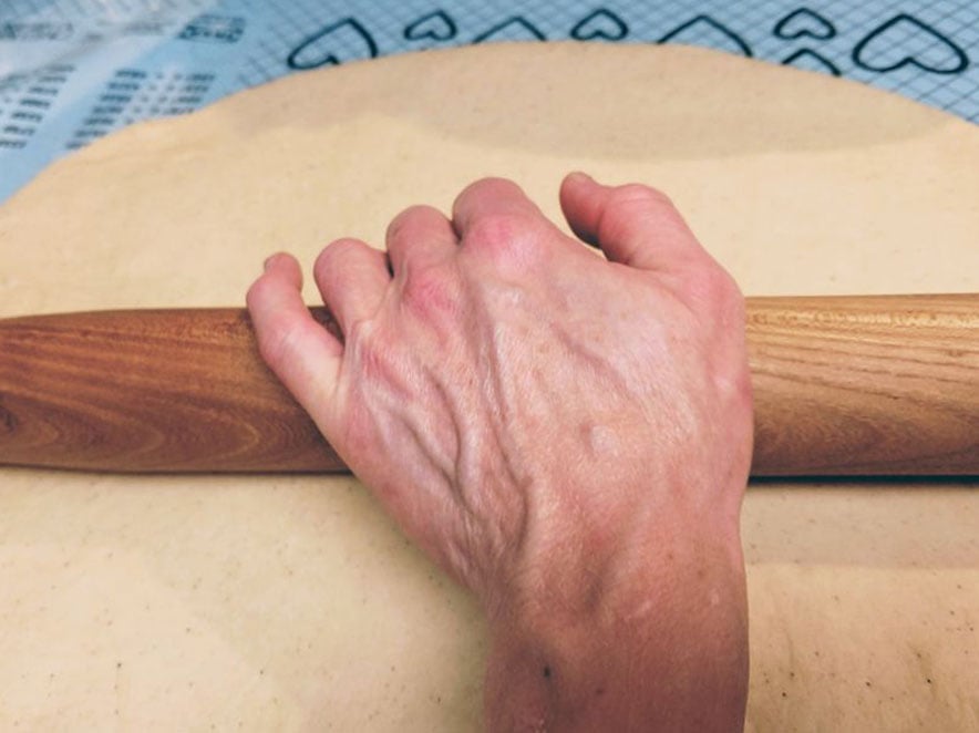 Image of dough being rolled.