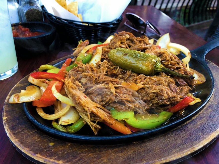 Carnitas kajitas served in a cast iron skillet