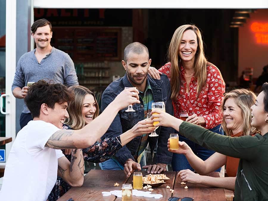 People toast cider to each other