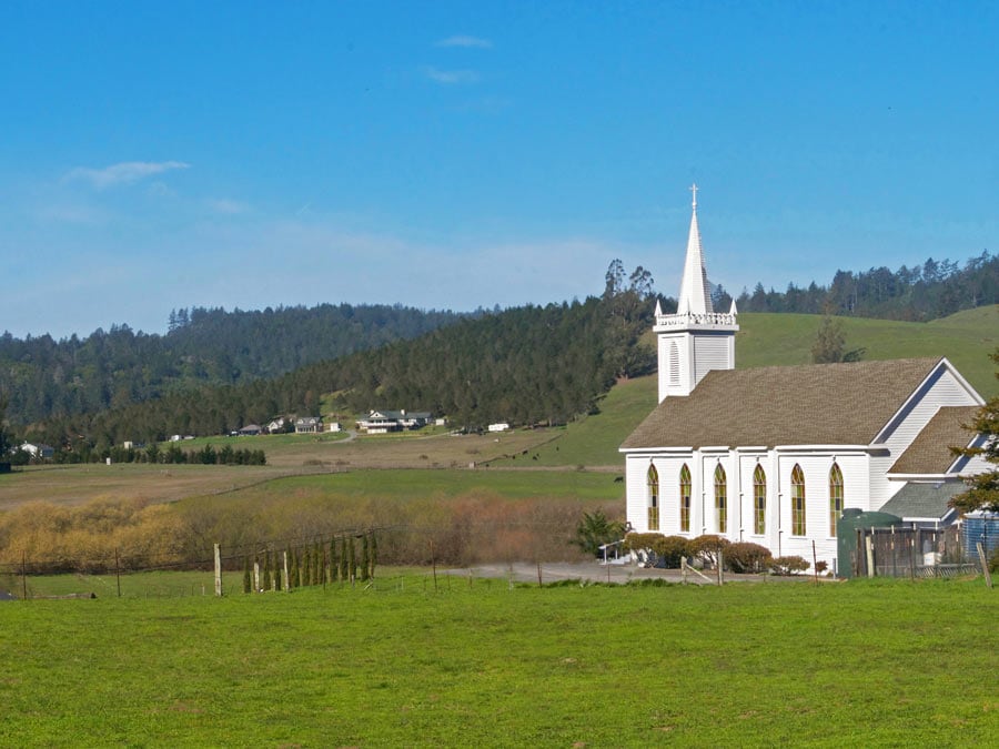 The church sits on a grassy knoll in the spring