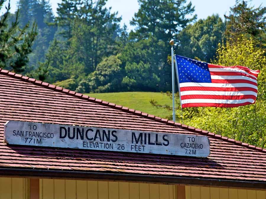 An American flag flies on the old train depot