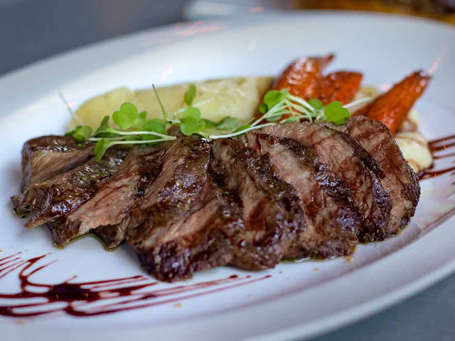 steak and vegetables on white plate