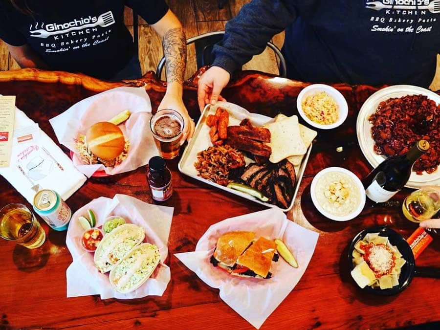 A photo of a spread of many dishes overhead including BBQ