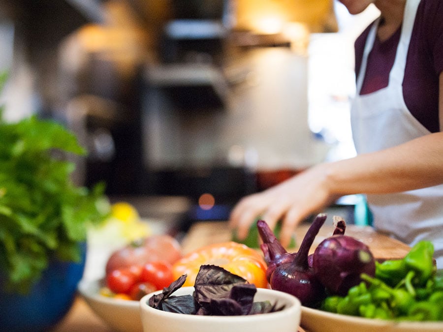 A chef preps dinner with fresh vegetables at Lowell's, Sebastopol