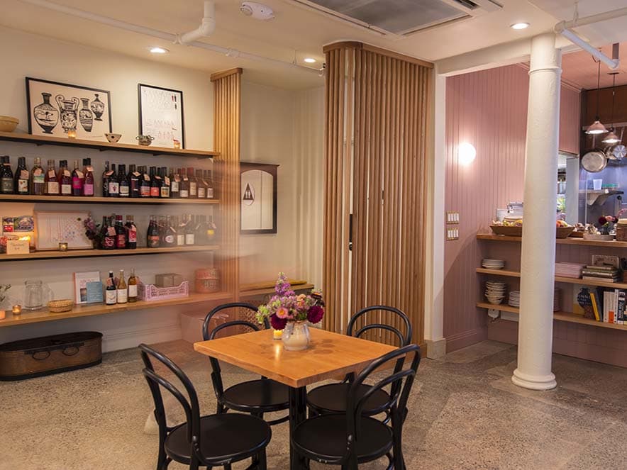 interior with table and wine on shelves