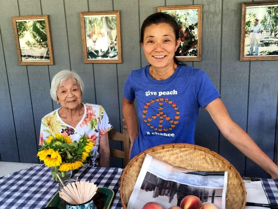 Farmers at Dry Creek Peach & Produce show off their peaches at their farm in Healdsburg