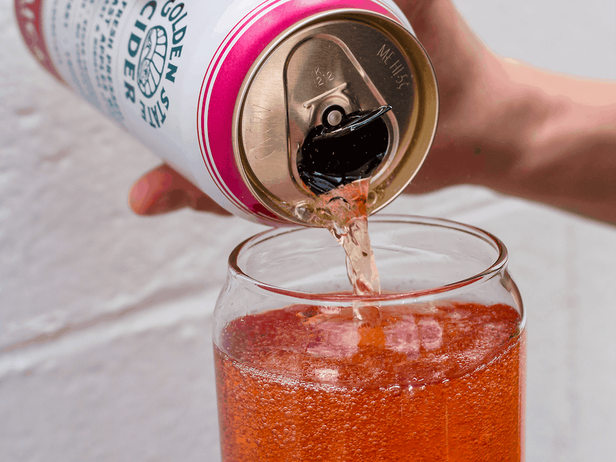 Jamaica, a pink cider from Golden State Cider, being poured from a can into a glass