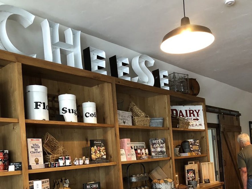 interior image of shelving with products on them in Valley Ford Cheese and Creamery in Sonoma County