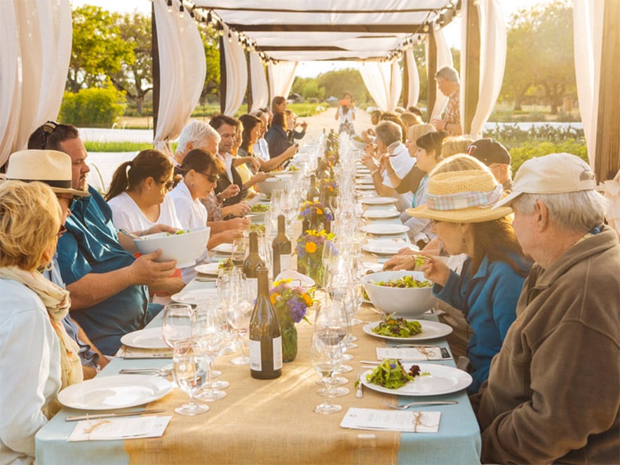 People dine outside under a pergola at Kendall-Jackson Wine Estate & Gardens in Sonoma County