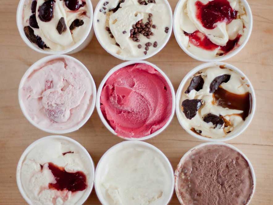 different flavors of ice cream in rows of cups