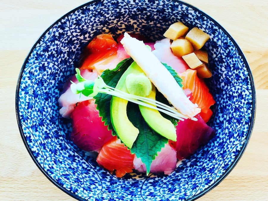 Blue and white bowl of fresh, colorful sashimi