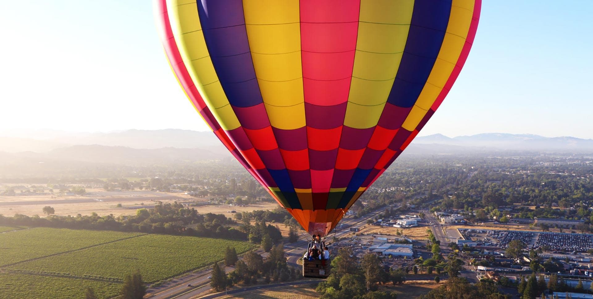 Hot air balloon floats above Sonoma Valley