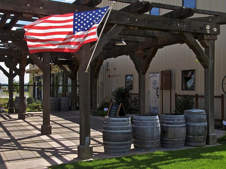 outside balletto winery with american flag and covered patio