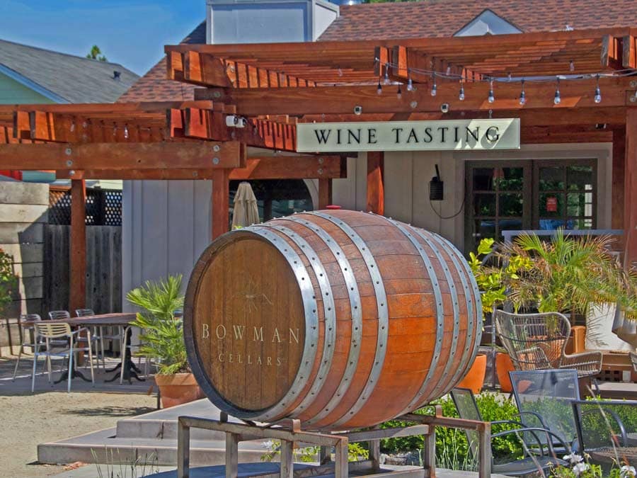 A barrel with the name of the tasting room sits out front