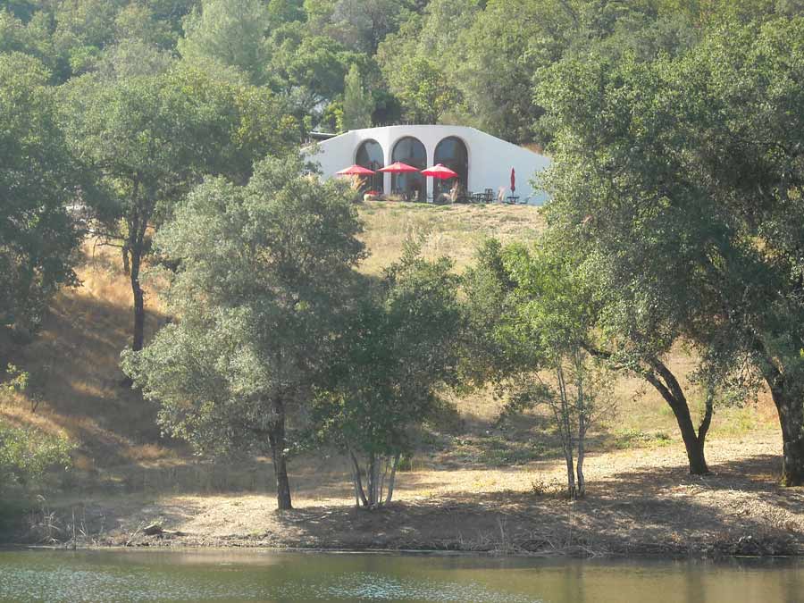 A view of the winery from across a lake