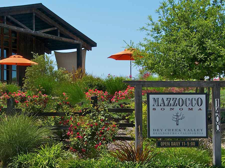 The entrance to the winery is surrounded by flowers