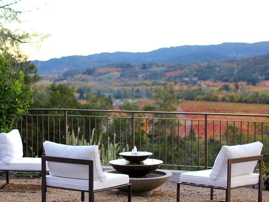 white chairs on patio overlooking dry creek valley