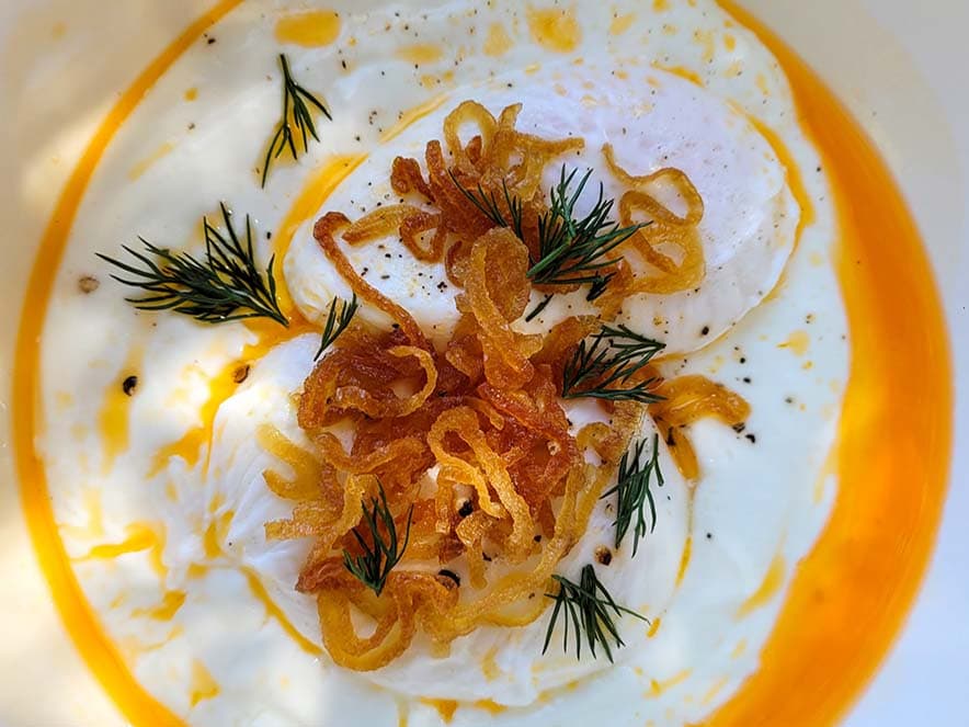 egg dish with fried onions and orange oil