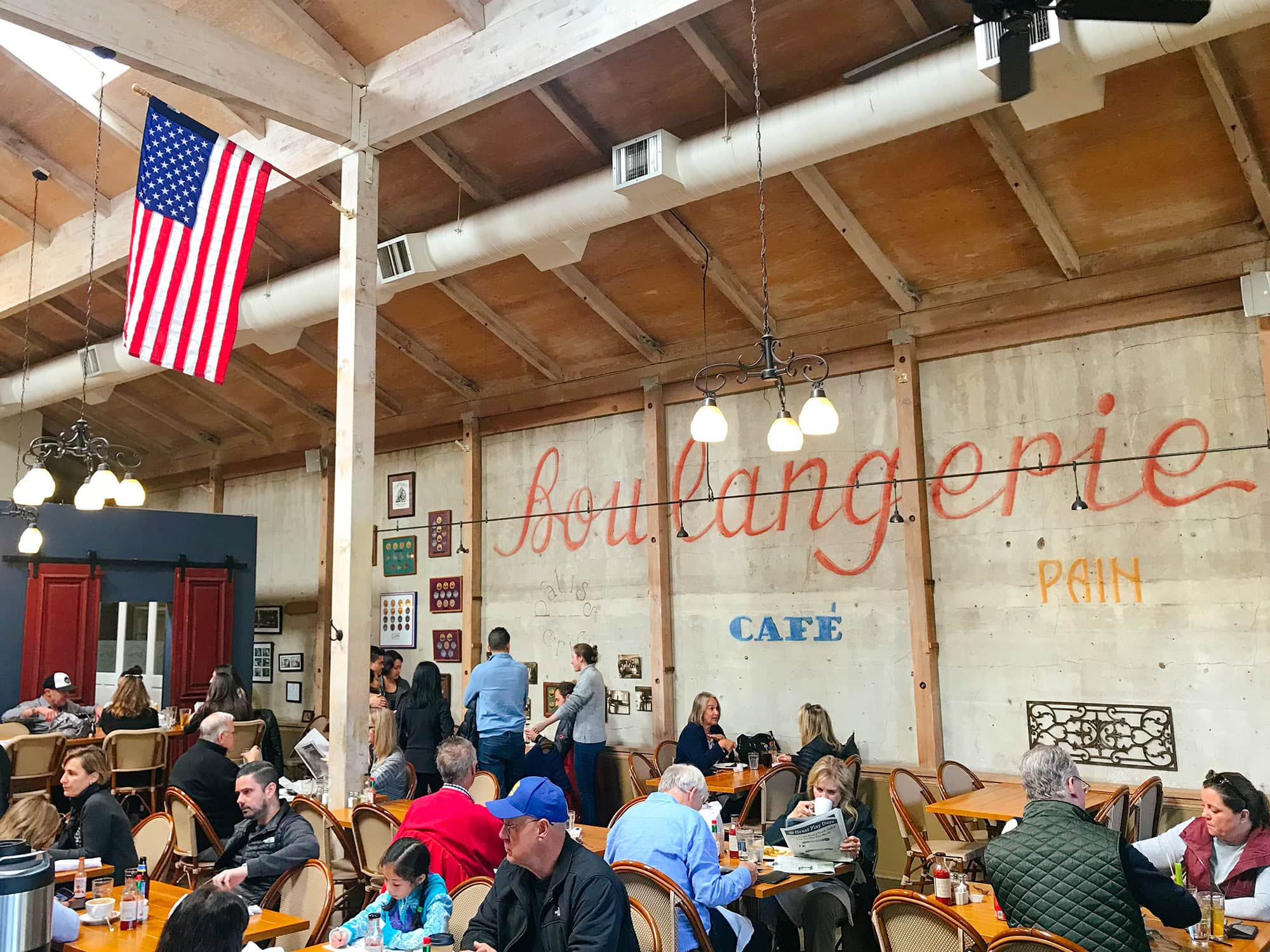 The bakery has Boulangerie painted on the interior wall