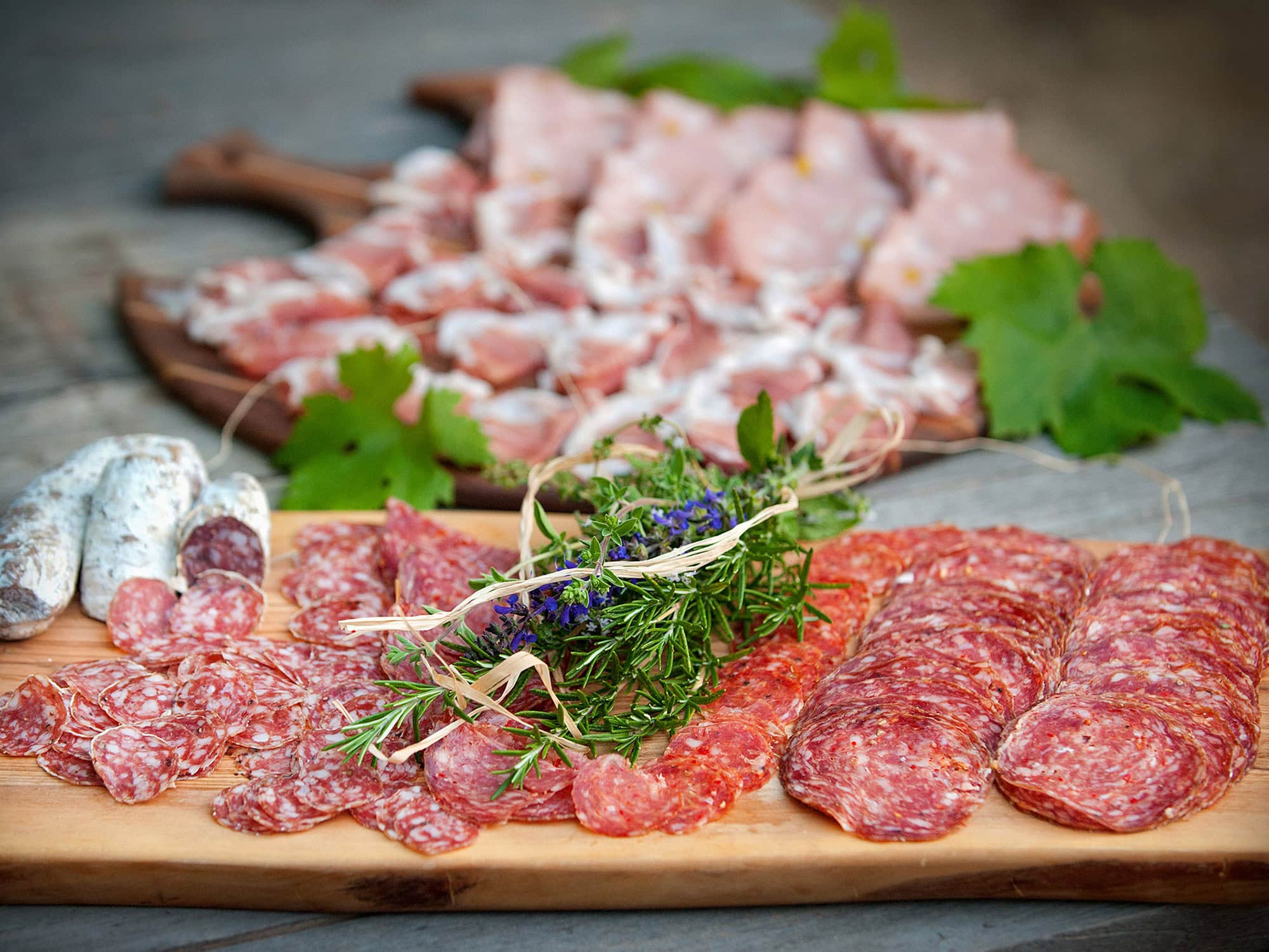 Sliced salami on a wooden board