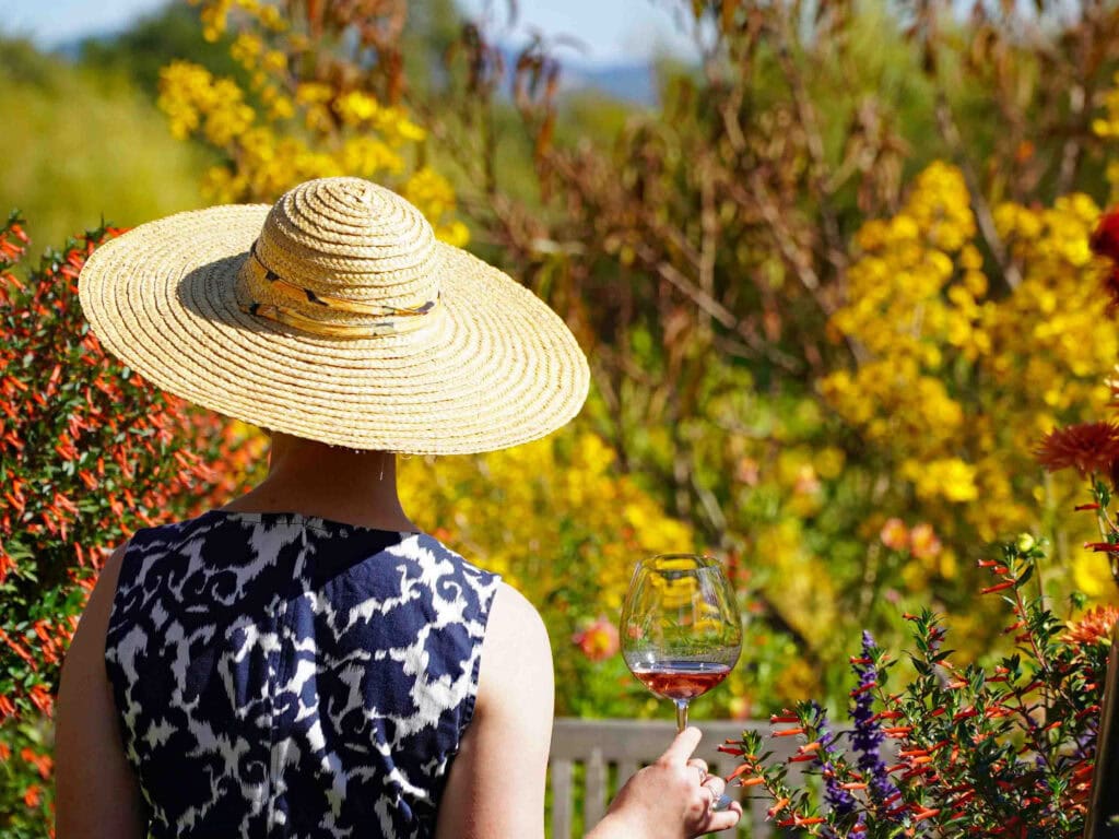 drinking rose wine in the wildflowers of sonoma county