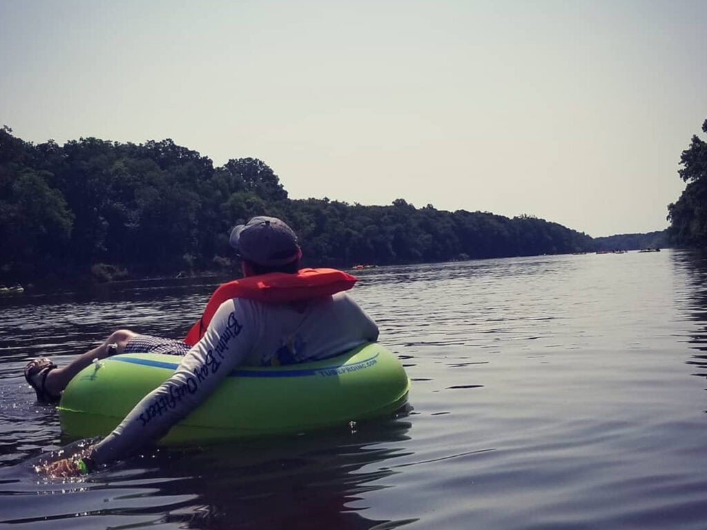 person tubing the russian river in healdsburg